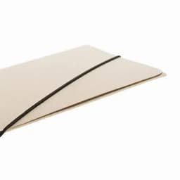 A notebook with a textured cream cover and a black elastic band closure.