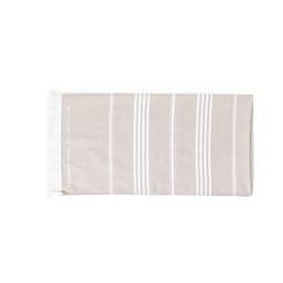 A cotton towel with a beige and white striped design, featuring tassels at one end and a logo.