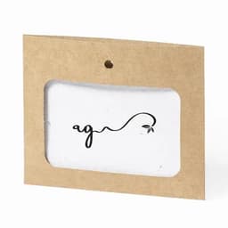 A tag with a simple black logo on a white background, attached to a brown cardboard backing.