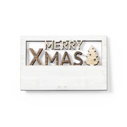 A wooden decorative sign featuring the words "MERRY XMAS" and a small Christmas tree design, set against a white background.