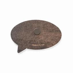 A brown speech bubble-shaped product with a magnet on the back and a logo, labelled "Made in Europe."