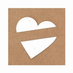 A heart-shaped card cutout on a brown kraft background, featuring a textured white design.