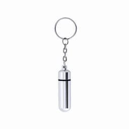 A keychain featuring a silver cylindrical capsule with a keyring attachment. The design is sleek and metallic.