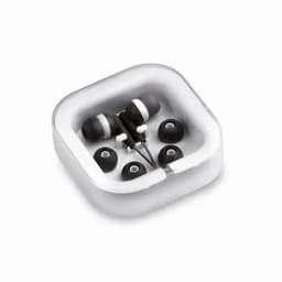 A pair of black earphones in a transparent case with additional earbud tips. The case has a square shape.