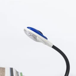 A desk lamp with a blue and white body, featuring a flexible neck and a light source at the top.
