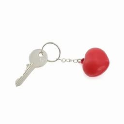 A red heart-shaped keychain with a metal key attached by a chain.