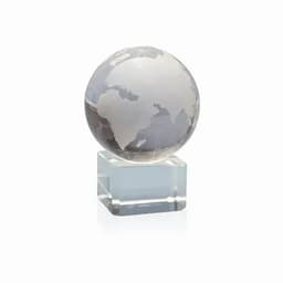 A glass globe featuring a frosted design of the continents, mounted on a clear rectangular base.