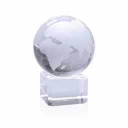 A crystal globe ornament with a clear base, showcasing an etched map of the world in shades of white and grey.