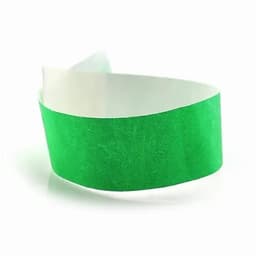 A green wristband made of paper material with a white inner section, featuring an adhesive tab for secure fastening.