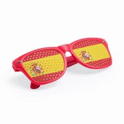 Red sunglasses featuring a Spain flag design with perforated lenses. Designed for promotional purposes, they have a playful look.