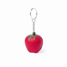 A keyring in the shape of a red strawberry, featuring green leaf accents and a metal chain.