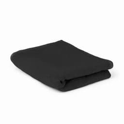 A folded black towel displayed neatly. It has a soft texture and appears to be a standard bath towel size.