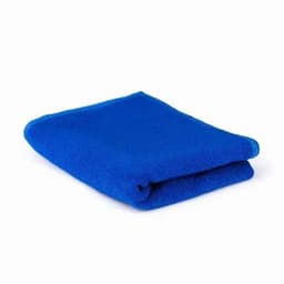 A folded blue towel, showcasing a soft texture, with a neat edge. The towel is lying on a white background.
