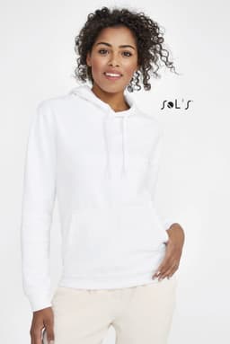 A white unisex hoodie with a fleece lining, featuring a pocket and a hood. The model has curly hair and is smiling.