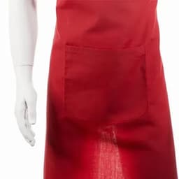 A red apron featuring a front pocket and displayed on a white, mannequin-style hand.