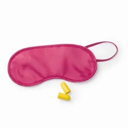 A pink sleep mask with a smooth finish accompanied by a pair of yellow earplugs.