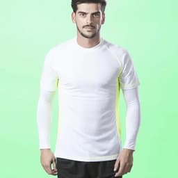 A long-sleeve athletic shirt in white with neon yellow accents, featuring a fitted design and crew neck.