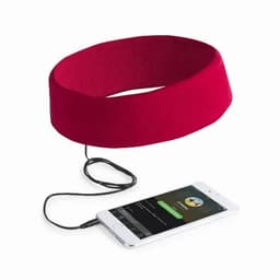 A red headband with an audio cable attached, next to a smartphone displaying a music app.