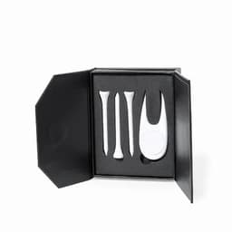 A golf accessory set including three white tees and a divot tool, presented in a black box with foam padding.