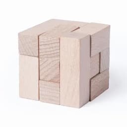 A wooden puzzle made of light-coloured blocks arranged in a cube shape, featuring various textures and sizes.