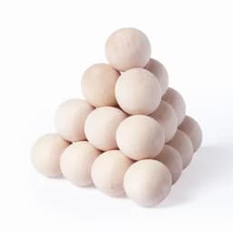 A pyramid of unpainted wooden balls stacked together, showcasing their natural light wood colour and smooth surfaces.