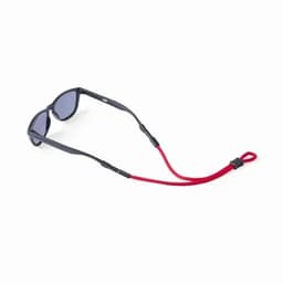 Sunglasses with a dark frame and grey lenses, featuring a red strap for added security.