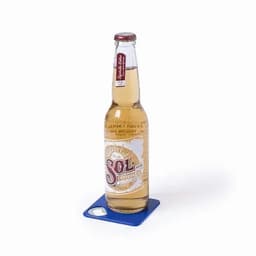 A drink bottle with a golden, clear beverage and a white label featuring a logo, set on a blue coaster.