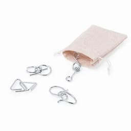 A small fabric pouch contains four metal clips in various shapes, including triangular and circular designs.