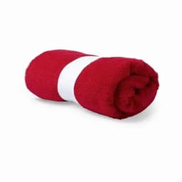 A rolled red towel secured with a white band, displaying a soft, textured surface.