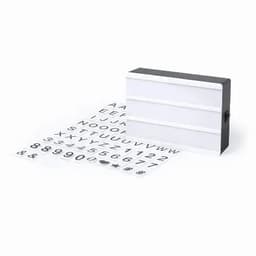 A light box with a black frame and white panel, accompanied by a sheet of letters, numbers, and symbols.