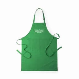 A green apron featuring a logo at the top and waist ties for secure fastening.