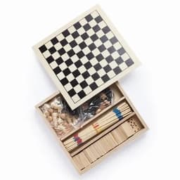 A wooden game box with a black and white chessboard on top, containing game pieces and sticks inside.