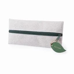 A pencil case in a light grey fabric with a green zip and a tag shaped like a leaf.