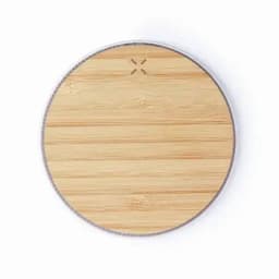 A round bamboo wooden surface with a silver rim and a small logo on top.