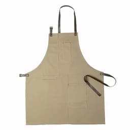 A beige apron with brown leather straps and multiple pockets for tools or utensils. Features a simple design.