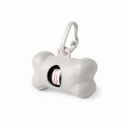 A grey bone-shaped dispenser with a clip, featuring a roll of waste bags inside.