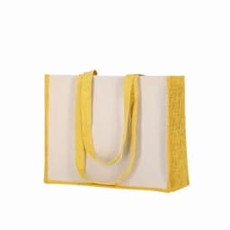 A tote bag featuring a cream body with yellow accents and sturdy yellow handles. It has a simple branded logo.
