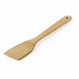 A wooden spatula with a flat, angled head and a long handle, showcasing a light brown finish.