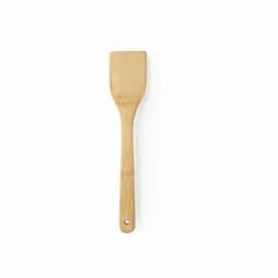 A bamboo spatula with a flat head and a long handle, featuring a hole for hanging.