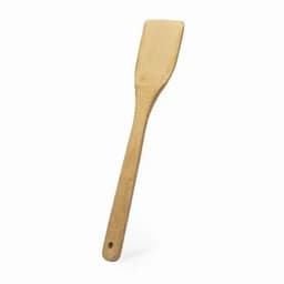 A bamboo spatula with a flat, rectangular head and a long handle, featuring a hole for hanging.