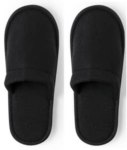 A pair of black, fuzzy slippers with a simple design, featuring open toes and a comfortable fit.