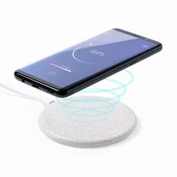 A wireless phone charger with a grey circular base and a smartphone hovering above it, with a logo visible.