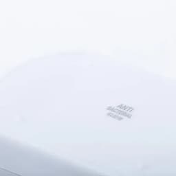A white antibacterial surface with embossed text. The image features smooth, clean contours.