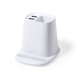A white charging station with two USB ports and an integrated wireless charging pad.