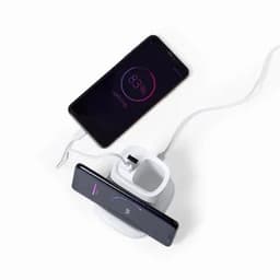 A charging dock with a white base, featuring a slot for a phone and a connected charging cable.