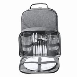 A portable picnic backpack featuring grey fabric, with cutlery, glasses, plates, and napkins neatly organised inside.