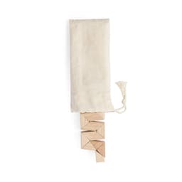 A set of wooden blocks arranged in a stack, with a natural fabric pouch above them.