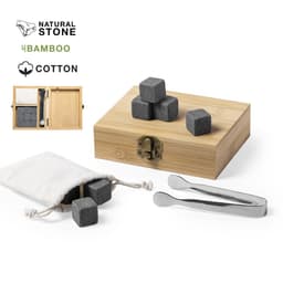 A wooden box containing grey natural stone drink chilling cubes, tweezers, and a cotton sack for storage.