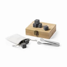 A wooden box containing grey whisky stones, a small pouch, and a pair of tweezers for handling the stones.