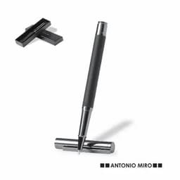 A sleek black pen with a chrome tip, resting on a chrome cap, displayed alongside a black presentation box.